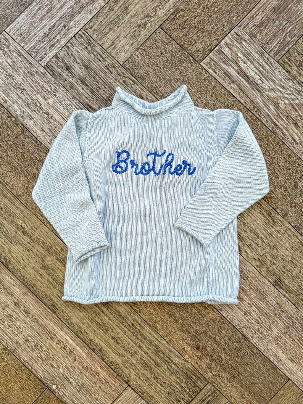 A Soft Idea Roll Neck Sweater in Light Blue with Brother