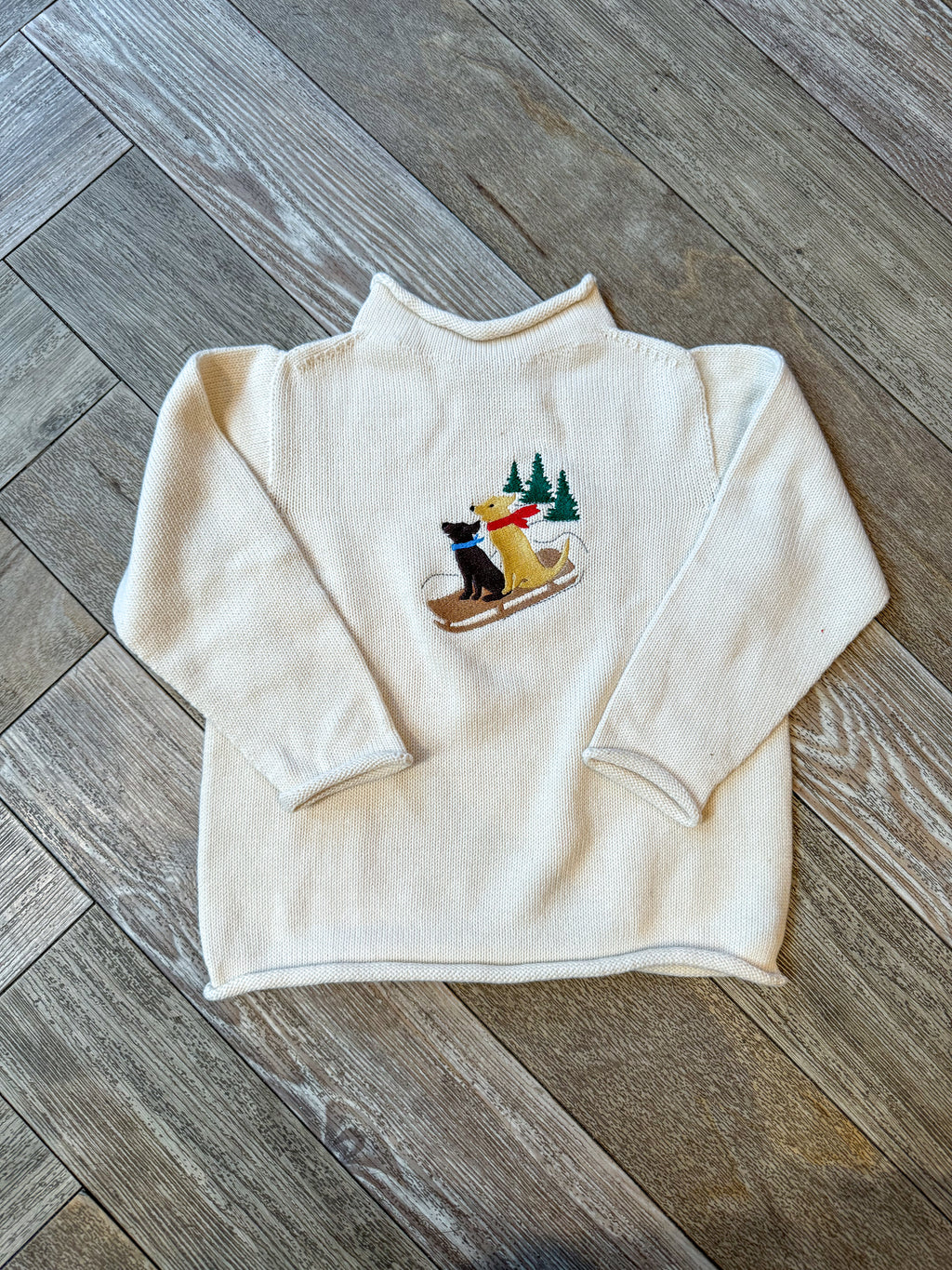 A Soft Idea Roll Neck Sweater in Cream with Dogs on Sled