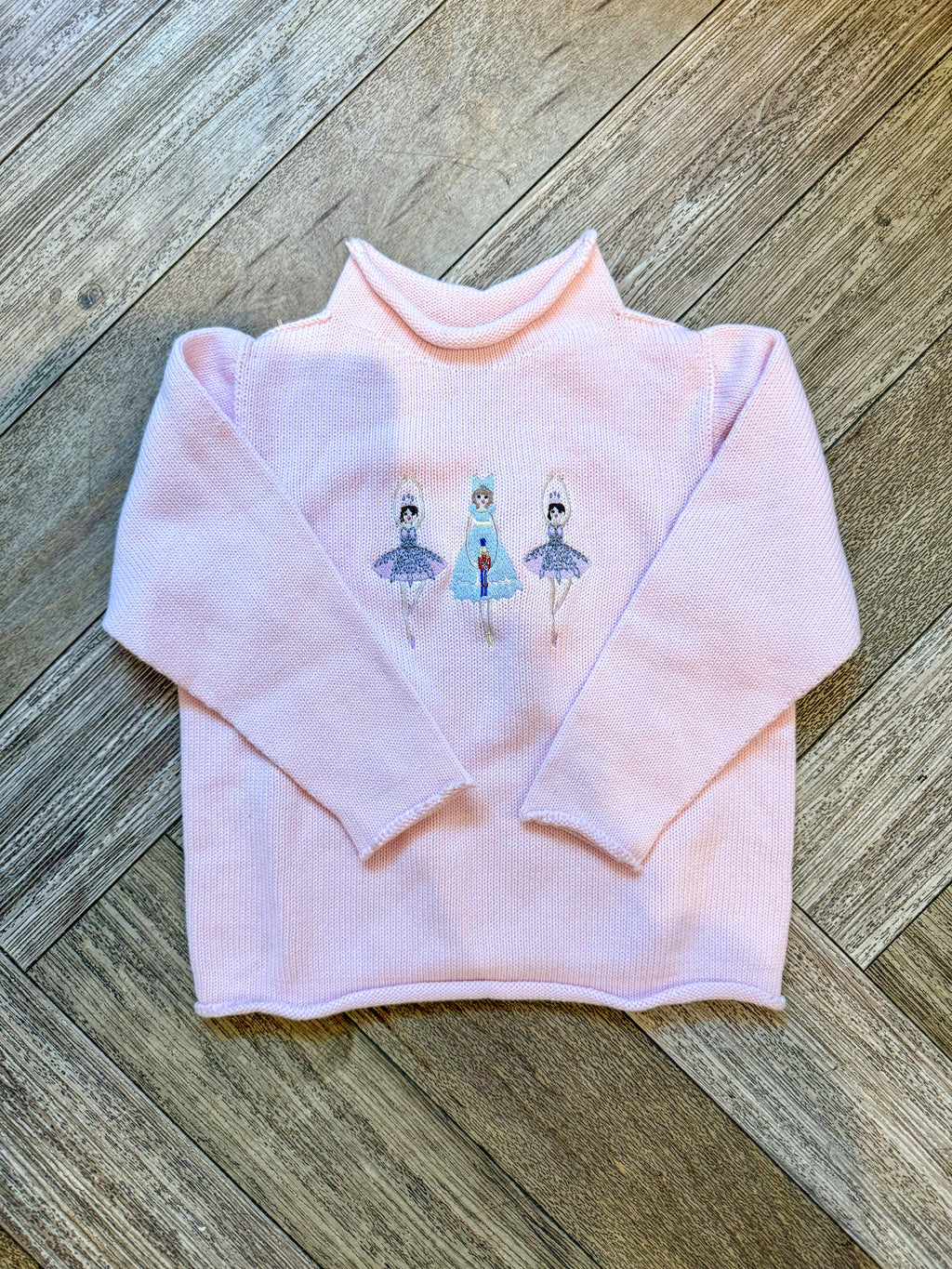 A Soft Idea Roll Neck Sweater in Pink with Nutcracker Ballerinas