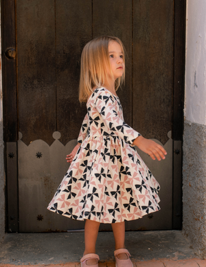 Good Apples Twirl Dress in Blush and Black Bows