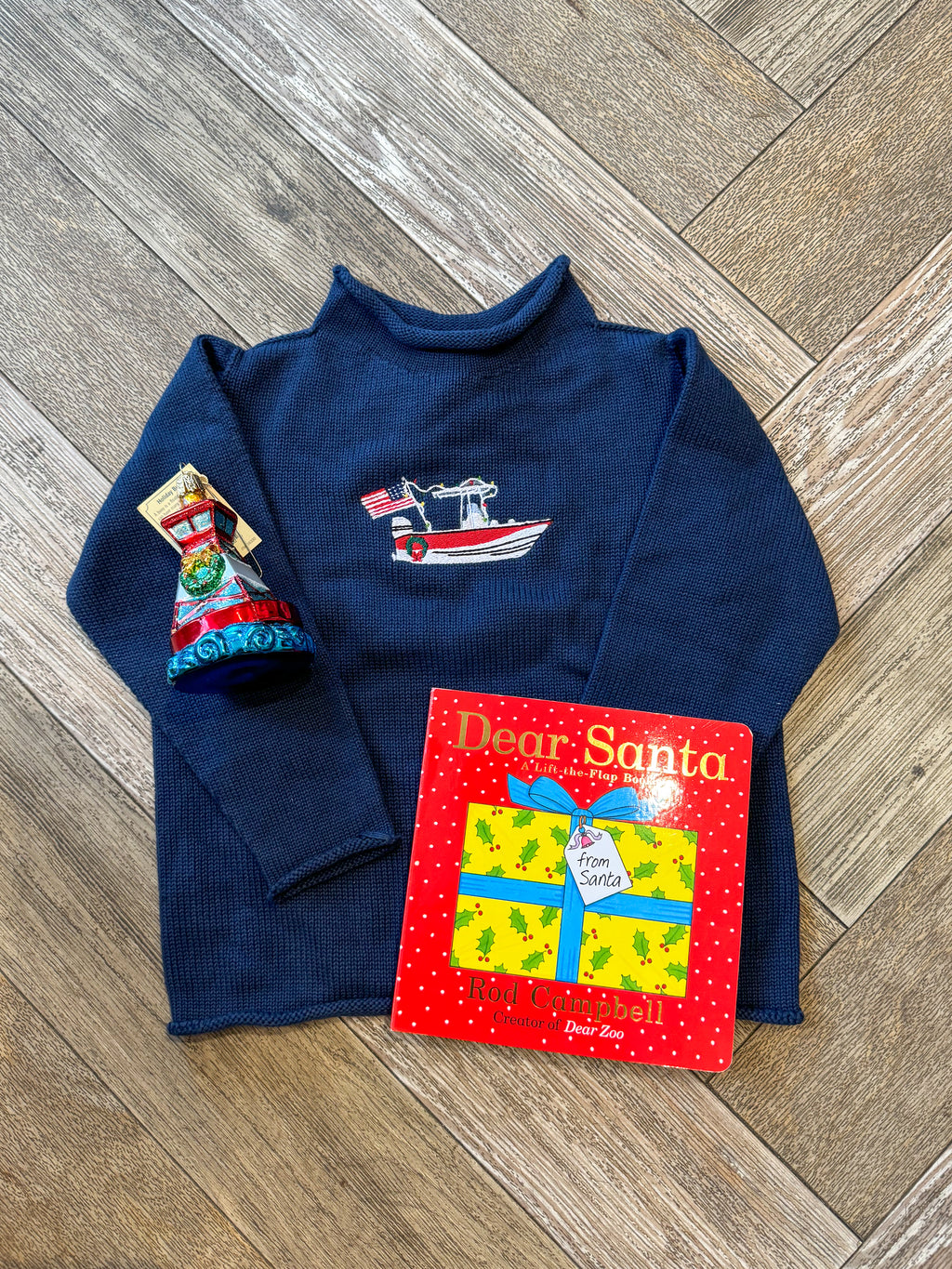 A Soft Idea Roll Neck Sweater in Navy with Boat with Holiday Lights