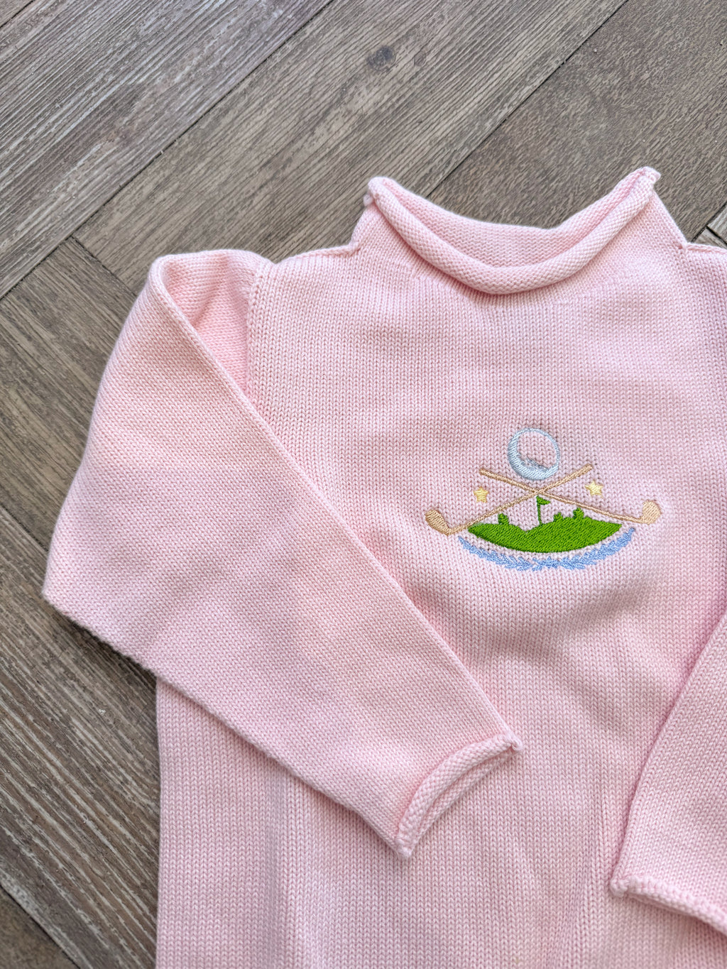 A Soft Idea Golf Crest Roll Neck Sweater in Pink