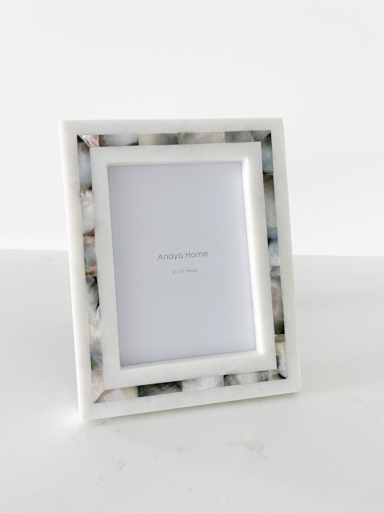 https://shopcrushboutique.com/cdn/shop/products/Anaya-Marble-Mother-Of-Pearl-Picture-Frame-Grey-5x7-3_1800x1800_6d160f67-82ce-4868-b8de-20e1d69c3cc5_2400x.jpg?v=1670517380